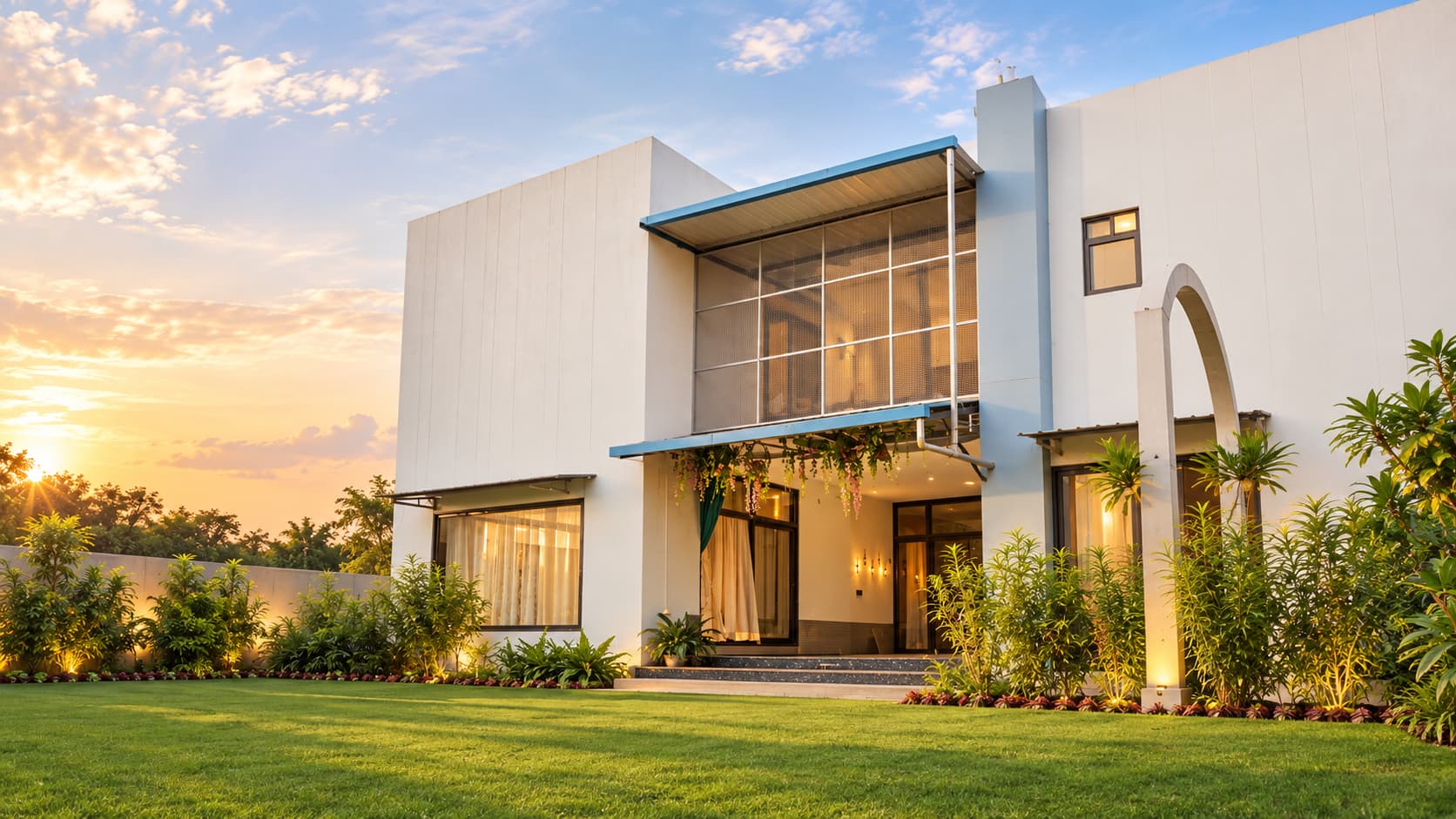 Modern villa and lawn at sunset